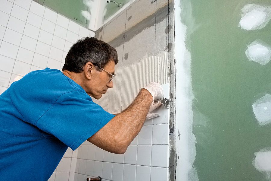 Man servicing bathroom renovations in Sydney